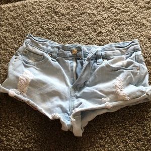 Ripped light blue jean shorts